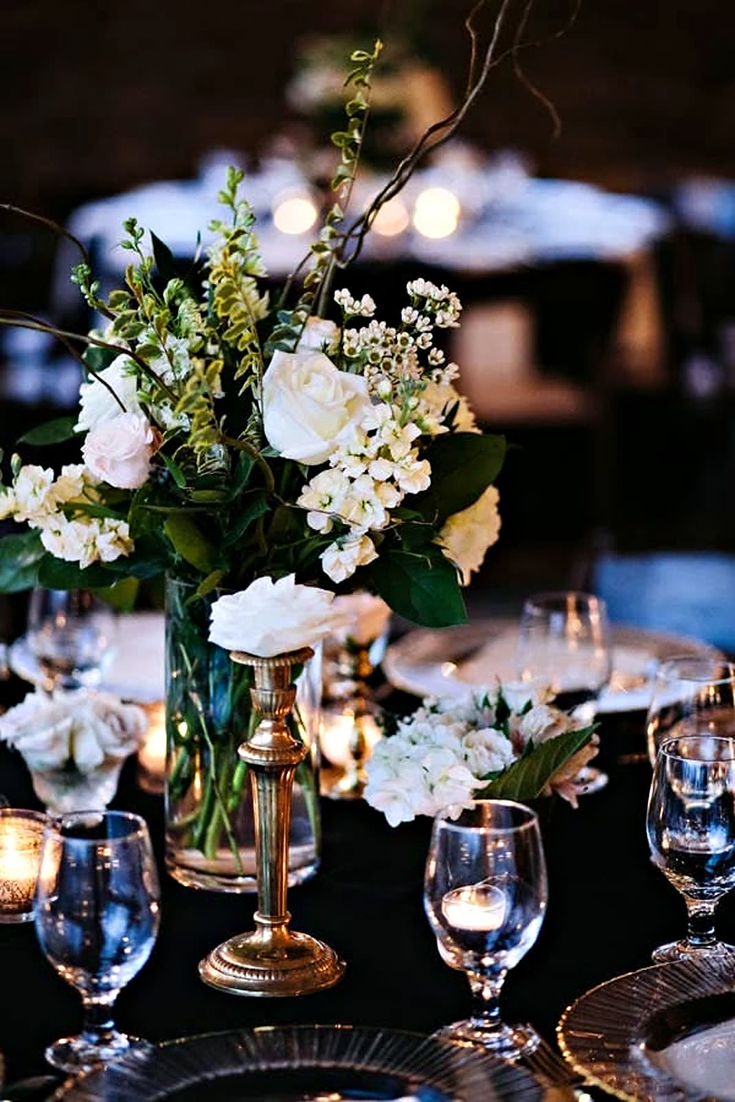 Tall white and green centerpiece on a banquet table